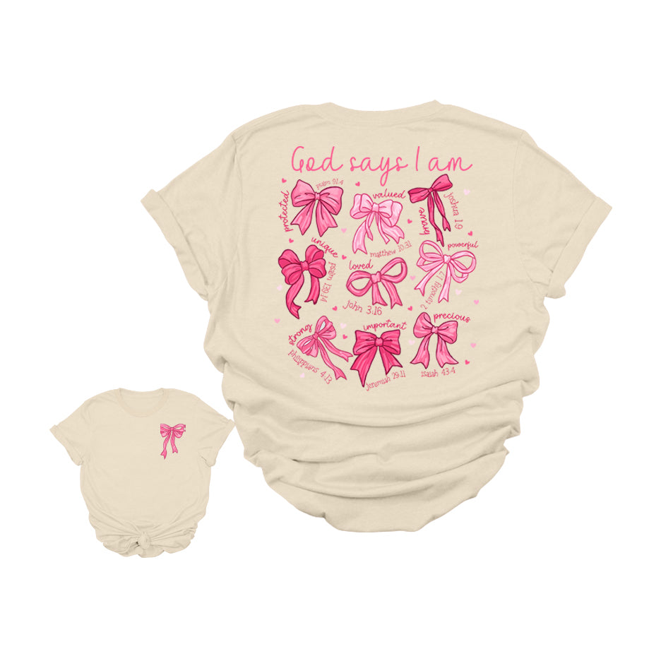 God Says I Am Christian Graphic T-Shirt | Faith-Based Bible Verse Bow Tee | Inspirational Scripture Shirt for Women | Cute Jesus Girl Aesthetic Tee | Uplifting Religious Affirmation T-Shirt